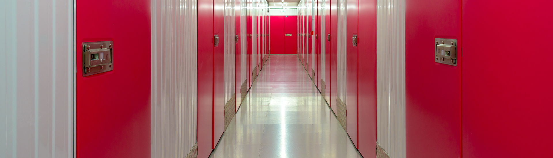 Image showing a self storage corridor with locked rooms
