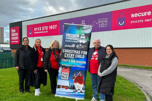 Image of The Store Room staff with Cash for Kids Charity staff