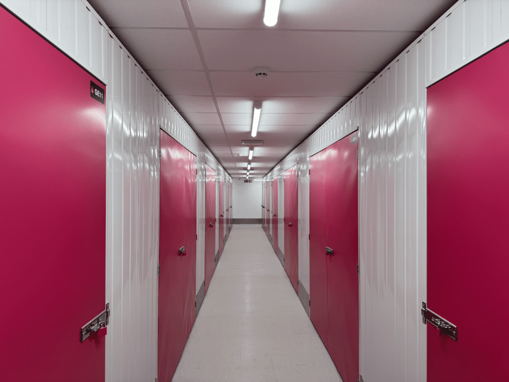 Image of self storage corridor with magenta doors